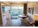 Cozy dining area featuring modern furnishings and a sliding glass door leading to a charming patio at 1370 Vegas Valley Dr # 47, Las Vegas, NV 89169