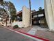 Building exterior featuring stucco and dark trim, with stairs leading to upper units at 1370 Vegas Valley Dr # 47, Las Vegas, NV 89169