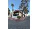 Building exterior with balconies and landscape featuring trees and red rock at 1370 Vegas Valley Dr # 47, Las Vegas, NV 89169