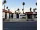 View of the building featuring the name 'Casa Vegas', palm trees, and desert landscaping at 1370 Vegas Valley Dr # 47, Las Vegas, NV 89169