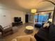 Open living area with bright lighting, comfortable seating, and a view to the kitchen at 1370 Vegas Valley Dr # 47, Las Vegas, NV 89169