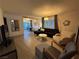 Spacious living room with tile flooring, neutral color palette, and access to the backyard at 1370 Vegas Valley Dr # 47, Las Vegas, NV 89169