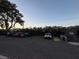 An asphalt parking lot is lined with cars, trees and shrubs at 1370 Vegas Valley Dr # 47, Las Vegas, NV 89169