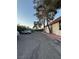 An outdoor parking lot with a row of parked cars along the building at 1370 Vegas Valley Dr # 47, Las Vegas, NV 89169