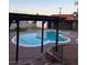 An in-ground pool is surrounded by a concrete patio and a wood pergola at 1370 Vegas Valley Dr # 47, Las Vegas, NV 89169