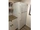 A clean white refrigerator next to a granite-look countertop and white subway tile at 1370 Vegas Valley Dr # 47, Las Vegas, NV 89169