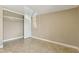 Comfortable bedroom featuring neutral walls, tile flooring, and closet with shelving for storage at 1405 Vegas Valley Dr # 257, Las Vegas, NV 89169