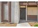Inviting condo entrance featuring secure front door and window, set in a well-maintained exterior at 1405 Vegas Valley Dr # 257, Las Vegas, NV 89169