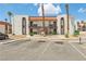 Charming two-story condo building with a red tile roof and well-maintained landscaping in a residential area at 1405 Vegas Valley Dr # 257, Las Vegas, NV 89169