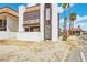 Charming condo exterior features a balcony, stucco siding, and a red tile roof amidst desert landscaping at 1405 Vegas Valley Dr # 257, Las Vegas, NV 89169