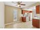 Functional kitchen featuring classic wood cabinets, white appliances, and a ceiling fan for added comfort at 1405 Vegas Valley Dr # 257, Las Vegas, NV 89169