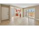 A tiled living room opens into the kitchen, complemented by a ceiling fan and a sliding door to the patio at 1405 Vegas Valley Dr # 257, Las Vegas, NV 89169