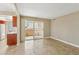 Cozy living room with tile floors, flows into a compact kitchen with sliding glass doors leading to outdoor space at 1405 Vegas Valley Dr # 257, Las Vegas, NV 89169