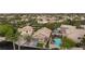 The aerial view showcases a home with a pool and spa in a lush neighborhood setting at 19 Dryden Park Ave, Las Vegas, NV 89148