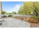 Large backyard featuring a patio and mature landscaping for privacy at 19 Dryden Park Ave, Las Vegas, NV 89148