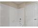 Clean white bathroom featuring new bathtub with shower and updated fixtures at 19 Dryden Park Ave, Las Vegas, NV 89148