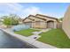 Charming single-story home with well-maintained lawn and covered vehicle at 19 Dryden Park Ave, Las Vegas, NV 89148