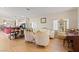 Spacious living room with elegant furniture, wood floors, and view of kitchen island at 19 Dryden Park Ave, Las Vegas, NV 89148