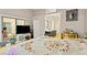 Comfortable main bedroom with a large window, tv and access to the bathroom with double sinks at 19 Dryden Park Ave, Las Vegas, NV 89148