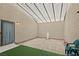 Enclosed patio featuring faux grass, stone pavers and privacy at 19 Dryden Park Ave, Las Vegas, NV 89148