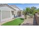 Spacious backyard with desert landscaping, a putting green, and a covered patio perfect for outdoor living at 1991 High Mesa Dr, Henderson, NV 89012