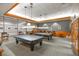Elegant billiard room with pool tables, comfortable seating, and decorative lighting fixtures at 1991 High Mesa Dr, Henderson, NV 89012
