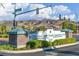 Inviting community entrance with well-maintained landscaping and clear signage at 1991 High Mesa Dr, Henderson, NV 89012