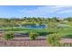 Scenic golf course view with a tranquil pond, fountain, and lush green landscaping at 1991 High Mesa Dr, Henderson, NV 89012