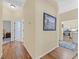 Inviting hallway with hardwood floors offering access to the kitchen and other rooms at 1991 High Mesa Dr, Henderson, NV 89012