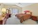 Bright main bedroom with bay window, ceiling fan, plush carpet, and stylish furnishings at 1991 High Mesa Dr, Henderson, NV 89012