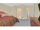Spacious carpeted main bedroom offering a serene retreat with views of the hallway and bathroom at 1991 High Mesa Dr, Henderson, NV 89012