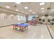 Bright recreation room with ping pong tables, fitness equipment, and mirrored walls at 1991 High Mesa Dr, Henderson, NV 89012