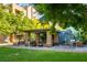 Lush landscaped grounds with an outdoor lounge area, perfect for recreation and relaxation at 20 E Serene Ave # 111, Las Vegas, NV 89123