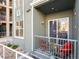 Charming balcony features bright red chairs and sliding glass doors at 20 E Serene Ave # 111, Las Vegas, NV 89123