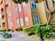 Attractive building exterior with colorful accents, well-maintained landscaping, and a welcoming sidewalk at 20 E Serene Ave # 111, Las Vegas, NV 89123