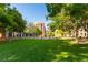 Well-maintained grassy lawn with mature trees, offering a serene and inviting outdoor space for residents at 20 E Serene Ave # 111, Las Vegas, NV 89123