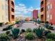 Landscaped community grounds with lush foliage and building views at 20 E Serene Ave # 111, Las Vegas, NV 89123