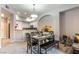 Dining area featuring contemporary furniture and views into kitchen with breakfast bar seating at 20 E Serene Ave # 111, Las Vegas, NV 89123