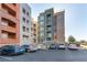 A view of the building with multiple balconies and parking spaces available at 20 E Serene Ave # 111, Las Vegas, NV 89123