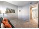 Bright living room with futon and view into bathroom, ideal for hosting guests or a home office at 20 E Serene Ave # 111, Las Vegas, NV 89123