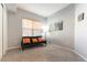 Comfortable living room featuring a futon, large windows, and a cozy atmosphere, perfect for relaxation at 20 E Serene Ave # 111, Las Vegas, NV 89123