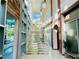 Modern staircase with a wall of windows providing ample natural light at 20 E Serene Ave # 111, Las Vegas, NV 89123