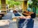 Outdoor patio with a fire pit, comfortable seating, and BBQ grill, perfect for entertaining and relaxation at 20 E Serene Ave # 111, Las Vegas, NV 89123