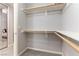 Spacious walk-in closet with ample shelving and storage space, conveniently located next to the bedroom at 20 E Serene Ave # 111, Las Vegas, NV 89123