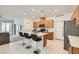 Open kitchen featuring an island with bar seating, stainless steel appliances, and ample cabinet space at 2110 Albury Ave, North Las Vegas, NV 89086