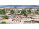 Wide aerial view of residential neighborhood showcasing houses and city buildings in the background at 2200 Stanley Ave, North Las Vegas, NV 89030