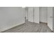 This is a bright bedroom featuring a walk-in closet and modern gray floors at 2200 Stanley Ave, North Las Vegas, NV 89030