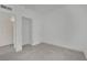 A bedroom boasts neutral decor with a closet and modern gray flooring at 2200 Stanley Ave, North Las Vegas, NV 89030