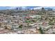 This is an aerial shot of the city showing other houses, buildings, trees, the mountains, and the sky at 2200 Stanley Ave, North Las Vegas, NV 89030