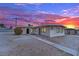 Exterior presenting desert landscaping, highlighting the home's practicality and nearby community at 2200 Stanley Ave, North Las Vegas, NV 89030